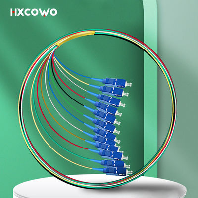 شراء FTTX HXCOWO 12 لون الألياف الضوئية ضفيرة SC UPC وضع واحد G657A 0.9 مم G652D تصنيع عبر الإنترنت